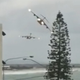 Illustration for article titled Watch This Pair Of C-17s Buzz An Australian Beach Town In Spectacular Fashion
